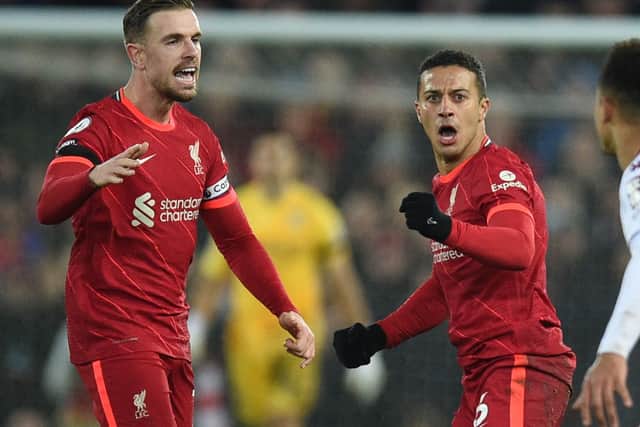 Liverpool midfielders Jordan Henderson and Thiago Alcantara. Picture: OLI SCARFF/AFP via Getty Images)