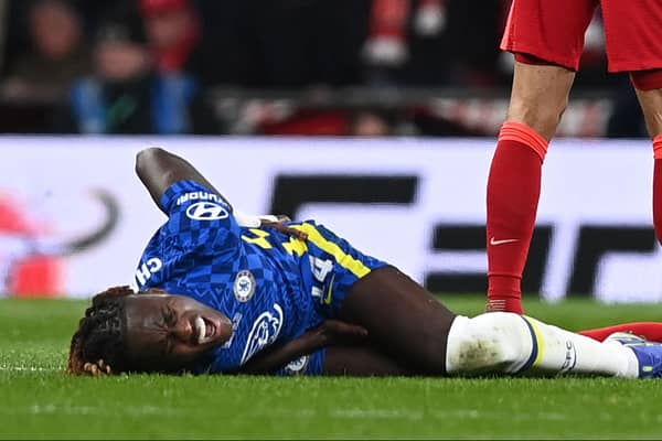 Trevoh Chalobah goes down injured during Chelsea’s Carabao Cup final loss to Liverpool Picture: GLYN KIRK/AFP via Getty Images