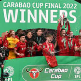 Jordan Henderson lifts the trophy as Liverpool win the 2022 Carabao Cup. 