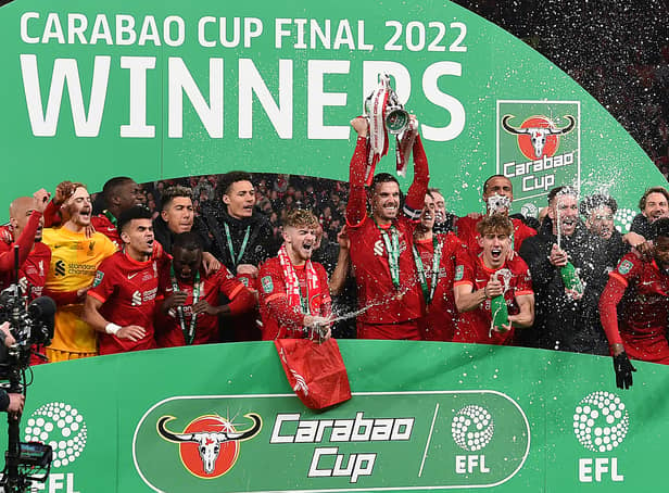 <p>Jordan Henderson lifts the trophy as Liverpool win the 2022 Carabao Cup. </p>