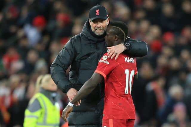 Sadio Mane celebrates Liverpool’s victory over West Ham with Jurgen Klopp. Picture: LINDSEY PARNABY/AFP via Getty Images