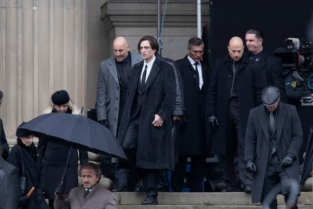 Bruce Wayne, played by actor Robert Pattinson, leaves Gotham City Hall - aka St George’s Hall