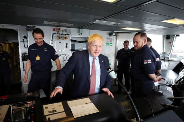 Boris Johnson sits on the bridge of HMS Dauntless during a visit to the Cammel Laird. Photo: PHIL NOBLE/POOL/AFP via Getty Images