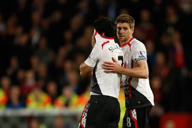 A dejected Luis Suarez dejected alongside Steven Gerrard after Liverpool’s 3-3 draw against Crystal Palace in May 2014. Picture: ADRIAN DENNIS/AFP via Getty Images