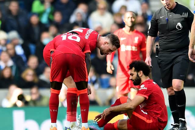 Mo Salah suffered a foot injury during Liverpool’s defeat of Brighton. Picture: Andrew Powell/Liverpool FC via Getty Image
