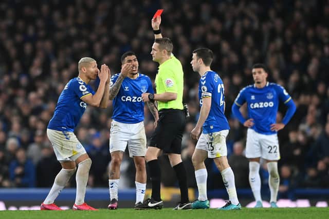 Allan of Everton is shown a red card from referee Craig Pawson during the Premier League match between Everton and Newcastle United.
