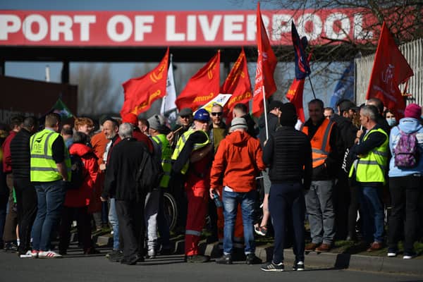Demonstrators gather outside the entrance to the Port of Liverpool. Photo: Anthony Devlin/Getty Images