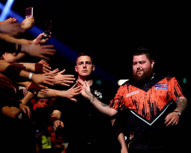 Michael ‘Bully Boy’ Smith of England walks out before he competes against Michael ‘Mighty Mike’ van Gerwen of Netherlands. Photo: Dean Mouhtaropoulos/Getty Images