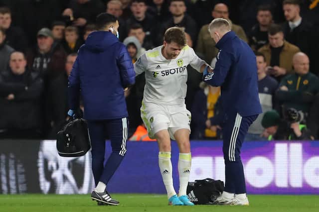 Patrick Bamford limps off for Leeds United. Picture: GEOFF CADDICK/AFP via Getty Images