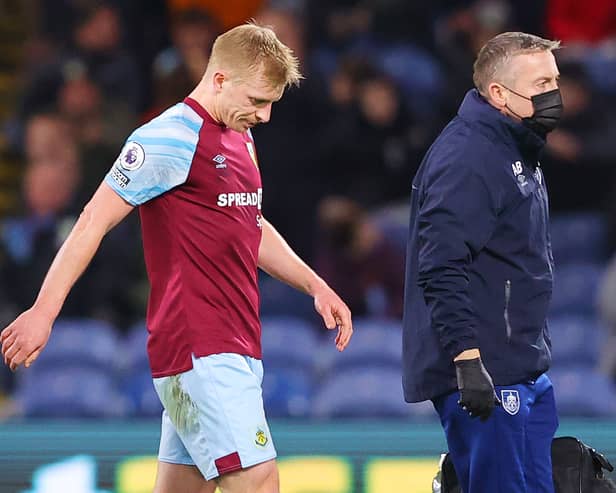 Ben Mee limps off injured for Burnley. Picture: Alex Livesey/Getty Images