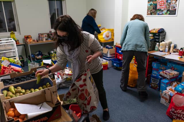 Volunteers are seen packing food parcels at a food bank. Photo: Peter Summers/Getty Images