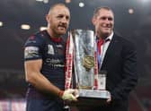 James Roby of St Helens holds the Grand Final Trophy with head coach Kristian Woolf. Photo: Lewis Storey/Getty Images
