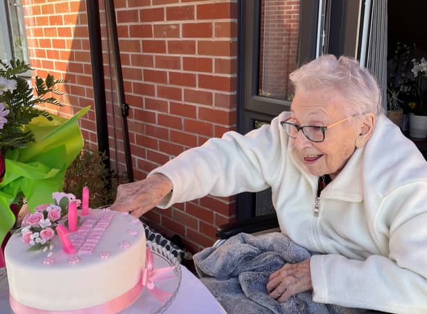 <p>Marjorie Hodnett, 108, cuts her birthday cake</p>