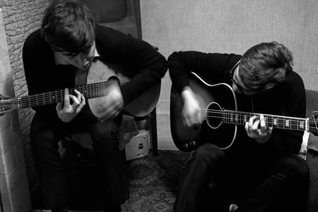  Paul McCartney and John Lennon writing I saw her standing there, 20 Forthlin Road, November 1962. Photo: Mike McCartney 