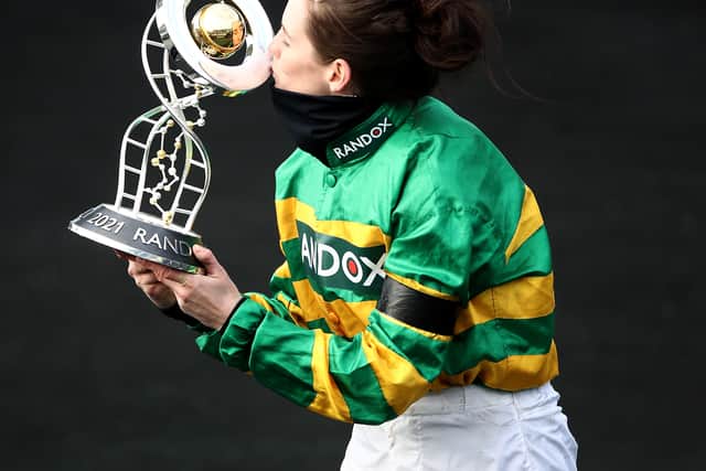 Jockey Rachael Blackmore receives the Randox Grand National Handicap Chase trophy after winning on Minella Times in 2021. Photo: Tim Goode - Pool/Getty Images