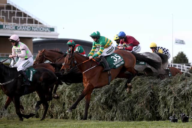 Minella Times ridden by Rachael Blackmore (35) clears a jump during The Randox Grand National Handicap Chase on Grand National Day of the 2021 Randox Health Grand National Festival at Aintree Racecourse
