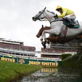 Neptune Collonges ridden by Daryl Jacob (C)  jumps the water jump on its way to winning the Grand National horse race at Aintree Racecourse in Liverpool, north-west England on April 14, 2012.  (AFP PHOTO/ANDREW YATES. (Photo: ANDREW YATES/AFP via Getty Images)