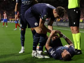 Kyle Walker goes down injured during Man City’s Champions League clash against Atletico Madrid. Picture: Arroyo Moreno/Getty Images