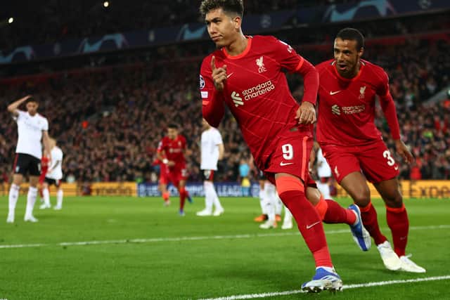 Roberto Firmino of Liverpool celebrates after scoring their team’s third goal. Photo: Clive Brunskill/Getty Images