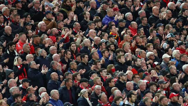 Liverpool fans applaud during the Premier League match between Liverpool and Manchester United at Anfield on April 19, 2022 in Liverpool, England. (Photo by Clive Brunskill/Getty Images)