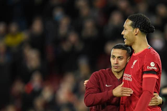 Thiago Alcantara celebrates Liverpool’s win with Virgil van Dijk. Picture: OLI SCARFF/AFP via Getty Images