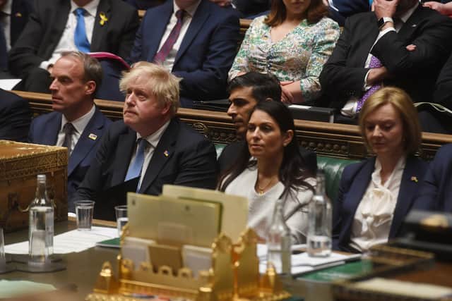 The Prime Minister Boris Johnson (second left) in the House of Commons where he made a statement to MPs following the announcement that he is among the 50-plus people fined so far as part of the Metropolitan Police probe into Covid breaches in Government. (UK Parliament/Jessica Taylor Handout photo)