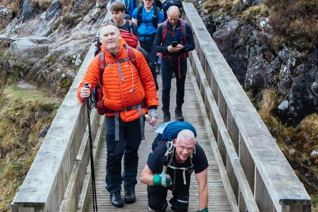 Paul Ellis begins the ascent of Ben Nevis. Photo: Lucy McAlpine Photography/ SWNS