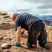 Paul Ellis whilst crawling up Ben Nevis. Image: Lucy McAlpine Photography/ SWNS