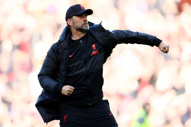 Jurgen Klopp, Manager of Liverpool celebrates with the fans after their sides victory during the Premier League match between Liverpool and Everton at Anfield on April 24, 2022 in Liverpool, England.