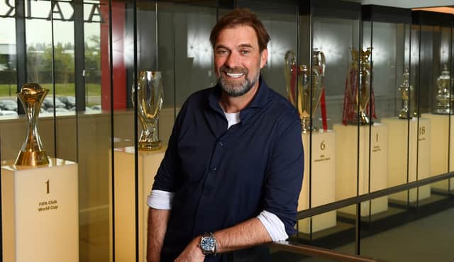 Jurgen Klopp poses after signing a new Liverpool contract. Picture: Andrew Powell/Liverpool FC via Getty Images