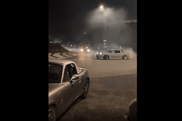 Drivers screeching around a roundabout in Wirral.