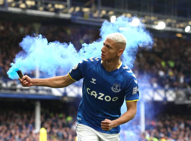 Richarlison of Everton celebrates with a flare after scoring their team’s first goal during the Premier League match between Everton and Chelsea at Goodison Park on May 01, 2022 in Liverpool, England. (Photo by Jan Kruger/Getty Images)