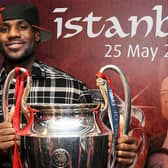 Lebron James poses with the Champions League trophy during a tour of Liverpool’s Anfield stadium. Picture: Andrew Powell/Liverpool FC via Getty Images