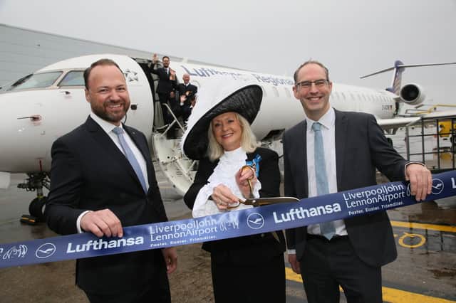 (L to R) Heinrich Lange, High Sheriff Lesley Martin-Wright and John Irving cutting the ribbon on Lufthansa’s new Frankfurt service from Liverpool.  Photo: LJLA