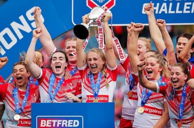 <p>St Helens lift the Women’s Challenge Cup.</p>