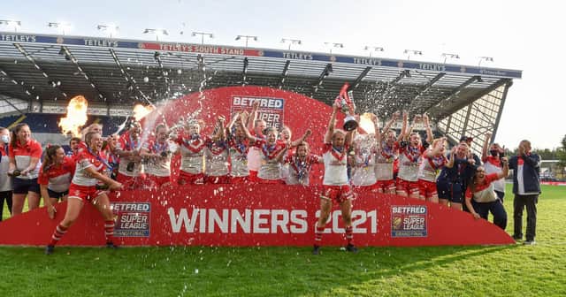 St Helen’s Women lift the 2021 Grand Final trophy.