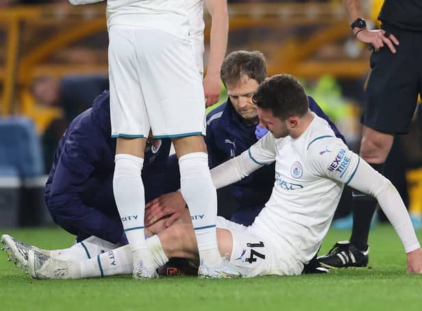 <p>Aymeric Laporte receives treatment during Man City’s win at Wolves. Picture: Catherine Ivill/Getty Images</p>