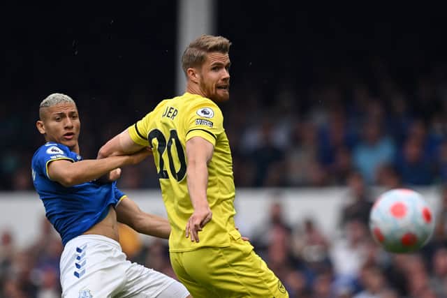 Everton’s Brazilian striker Richarlison fights for the ball it with Brentford’s Norwegian defender Kristoffer Ajer 