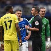 Referee Michael Oliver speaks with Brentford’s Ivan Toney Everton’s Vitaliy Mykolenko