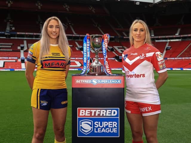 <p>Caitlin Beevers of Leeds and Jodie Cunningham of St Helens women with the Grand Final trophy. Image: BetFred RL Women’s Super League</p>