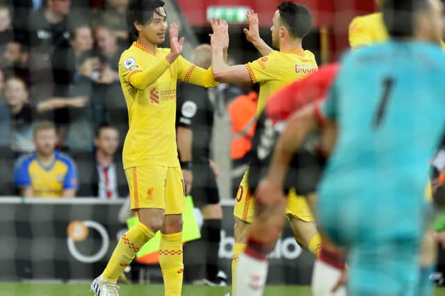 Takumi Minamino celebrates after scoring for Liverpool. Picture: Andrew Powell/Liverpool FC via Getty Images