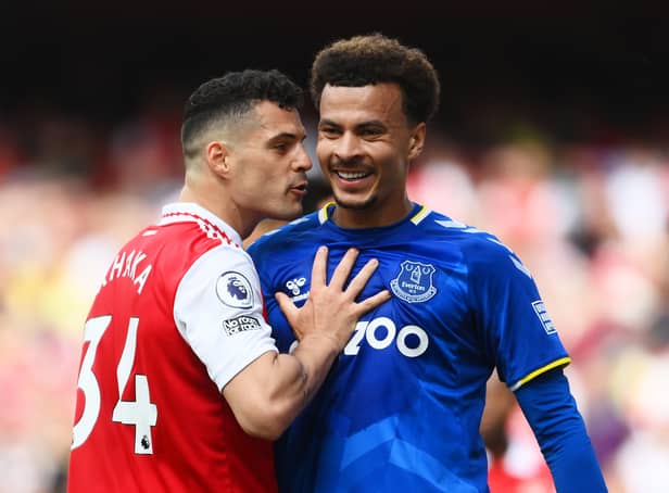 <p>Dele Alli and Granit Xhaka share a few choice words during Everton’s 5-1 defeat at Arsenal </p>