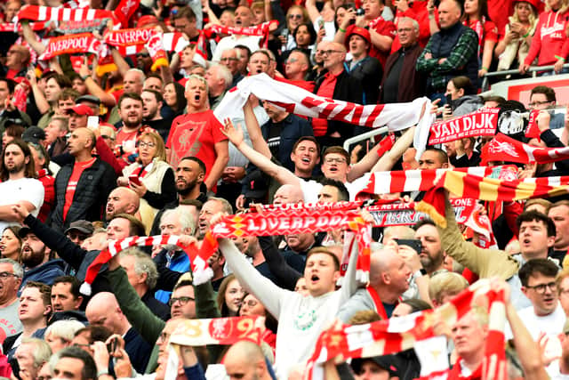  Fans of Liverpool holding up banners, scarfs and flags during the Premier League match between Liverpool and Wolverhampton Wanderers at Anfield on May 22, 2022 in Liverpool, England. (Photo by Andrew Powell/Liverpool FC via Getty Images)