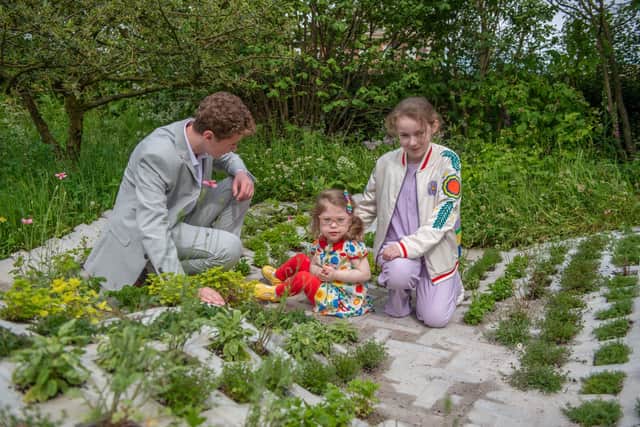 Children explore the picnic area in the H Miller Bros garden. Image: Jonathan Ward