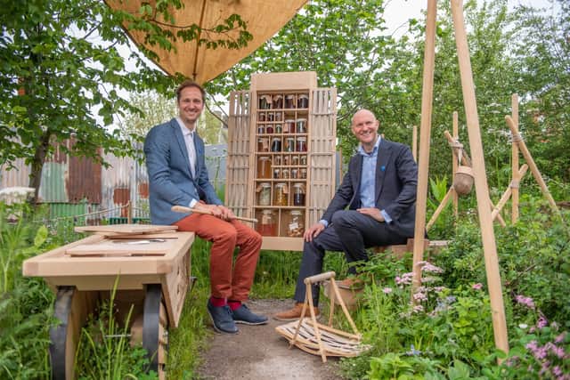 Brothers, Hugh & Howard Miller of H. Miller Bros sit in front of the garden’s mobile foraging kitchen an array of tools. Image: Jonathan Ward