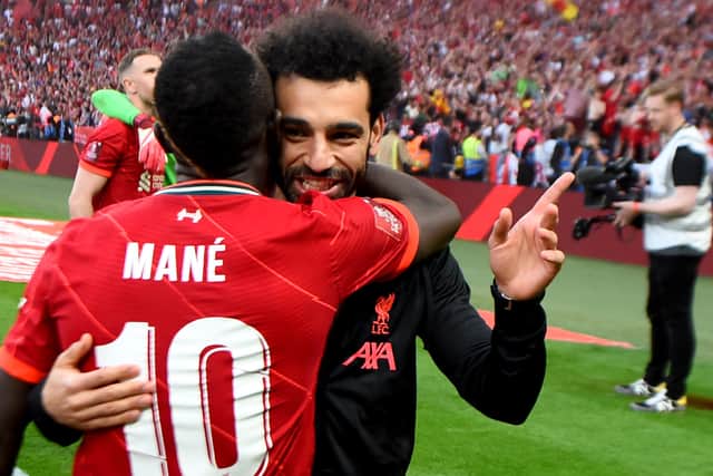 Sadio Mane and Mo Salah embrace after Liverpool’s FA Cup final triumph at Wembley. Picture: Andrew Powell/Liverpool FC via Getty Images