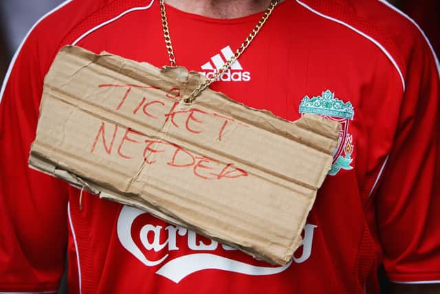 A Liverpool fan hunts for a ticket ahead of the Champions League final.  Image: Laurence Griffiths/Getty Images