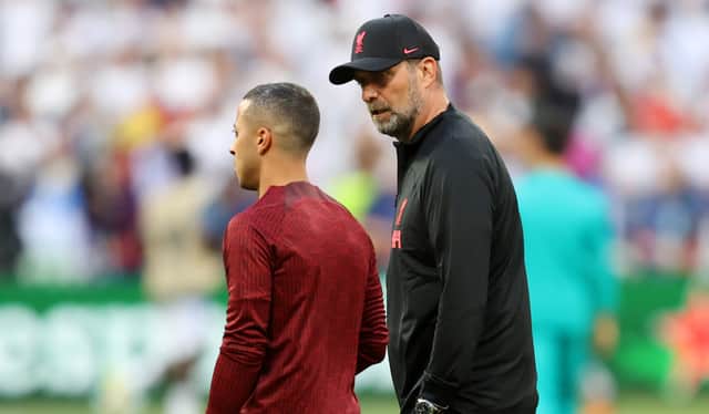 Thiago Alcantara in discussions with Liverpool boss Jurgen Klopp. Picture: Julian Finney/Getty Images
