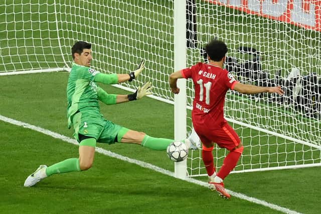 Mohamed Salah of Liverpool has a chance saved by Thibaut Courtois of Real Madrid during the UEFA Champions League final match between Liverpool FC and Real Madrid at Stade de France on May 28, 2022 in Paris, France. (Photo by Matthias Hangst/Getty Images)
