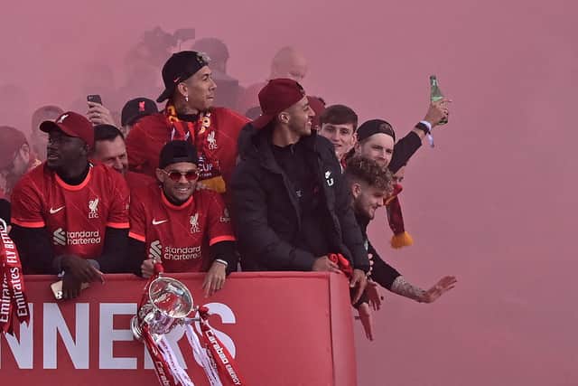 Ibou Konate, left, and Luis Diaz, centre, on Liverpool’s trophy parade. Picture: OLI SCARFF/AFP via Getty Images